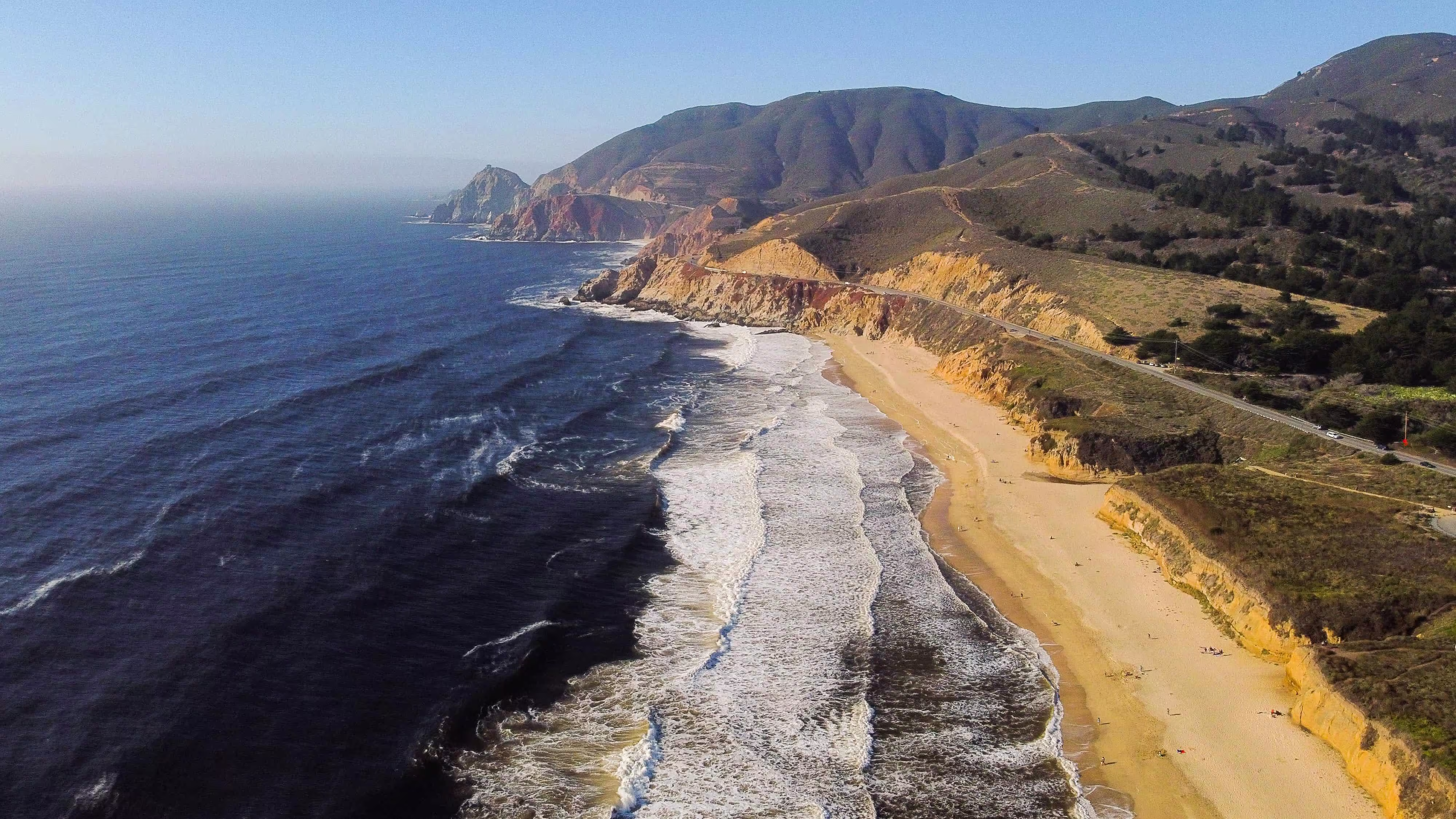 Coastal road along Half Moon Bay's cliffs and beaches