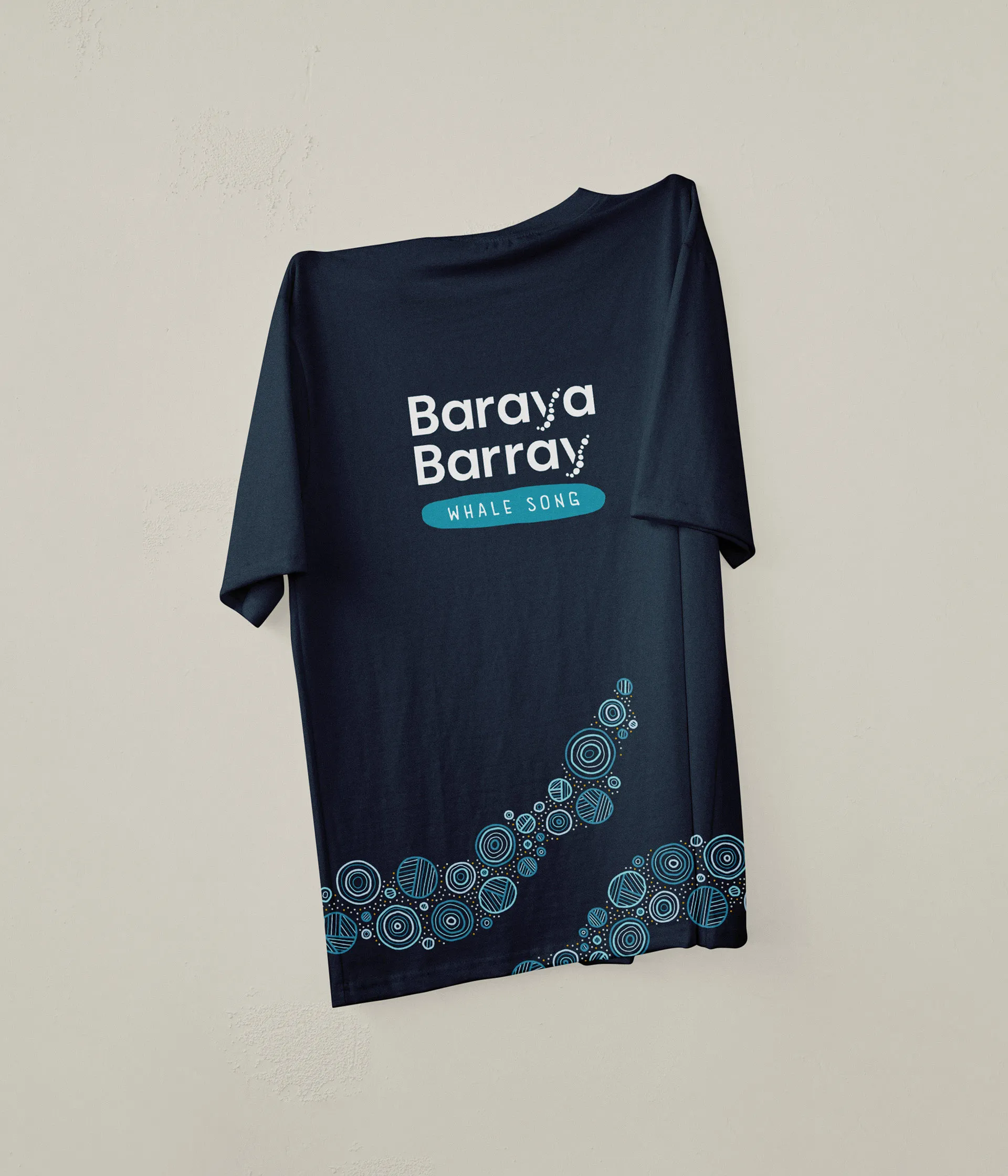The Baraya Barray logo and pattern work printed on a navy t-shirt