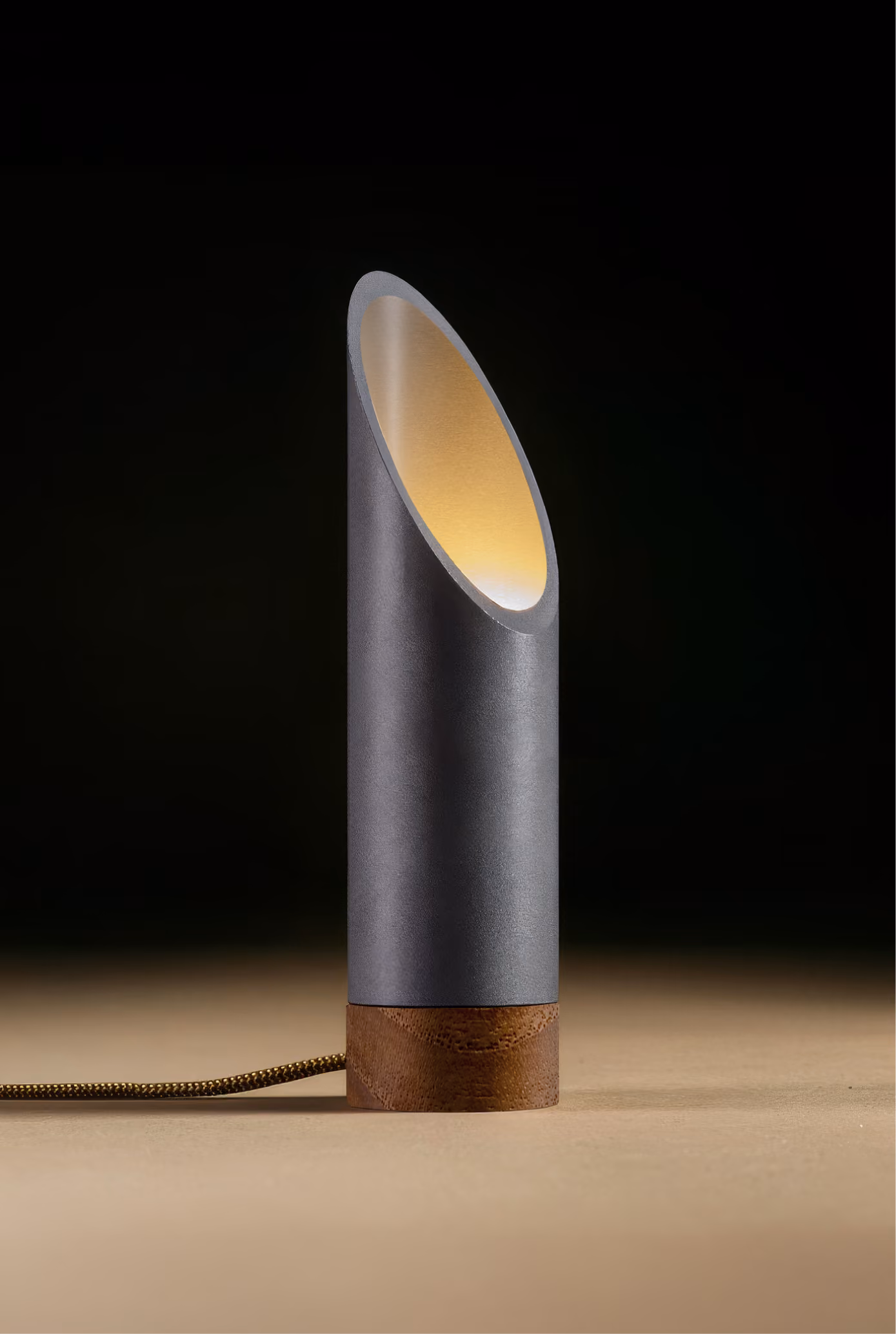 Crafted from salvaged skateboard half-pipe sections with warm copper accents.