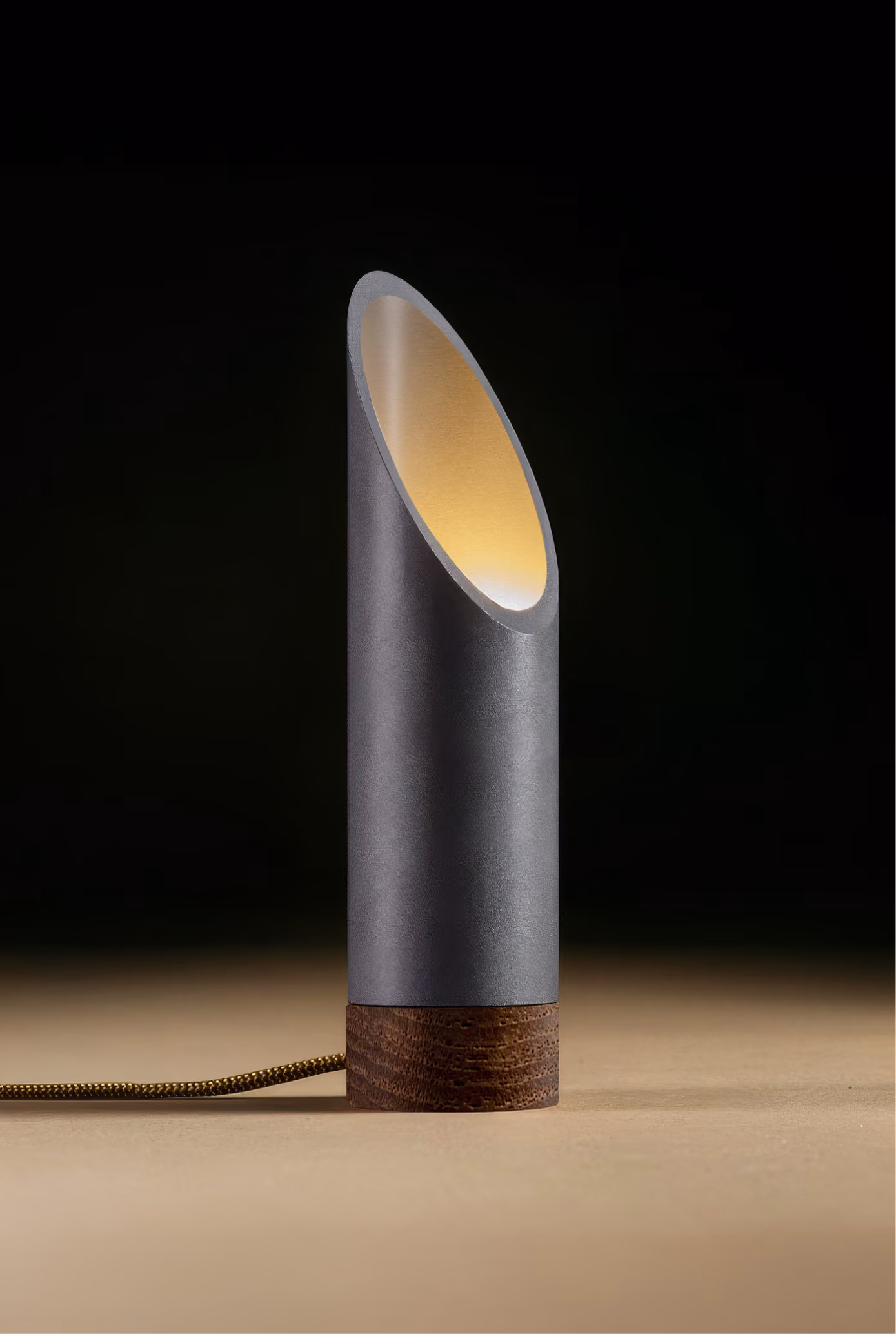 Crafted from salvaged skateboard half-pipe sections with warm copper accents.