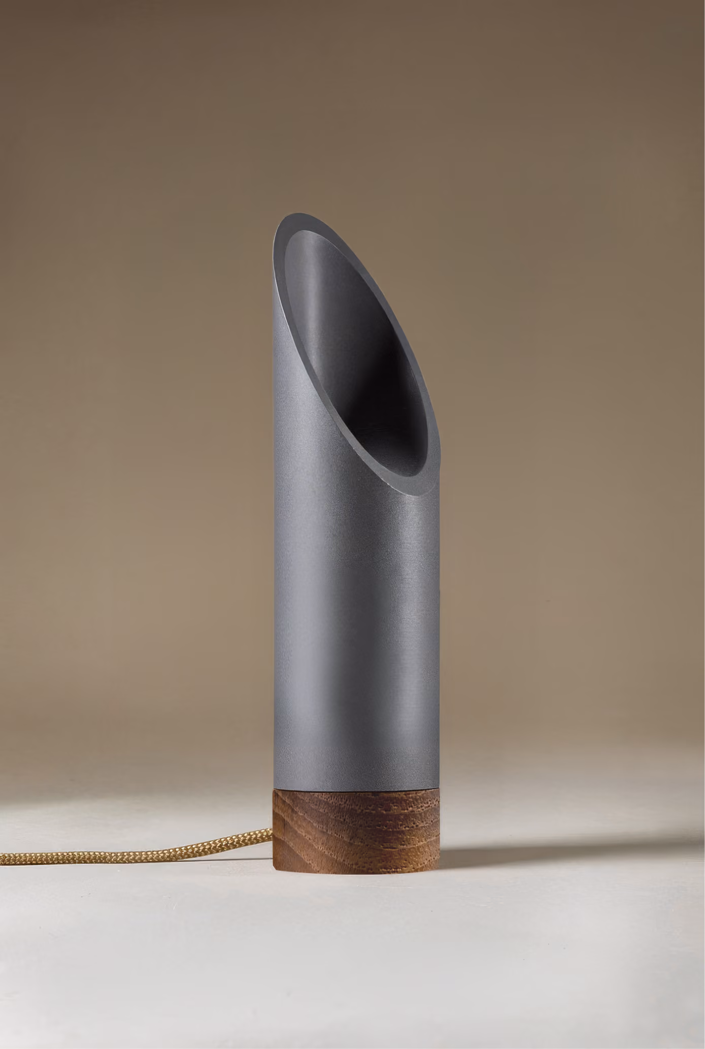 Crafted from salvaged skateboard half-pipe sections with warm copper accents.
