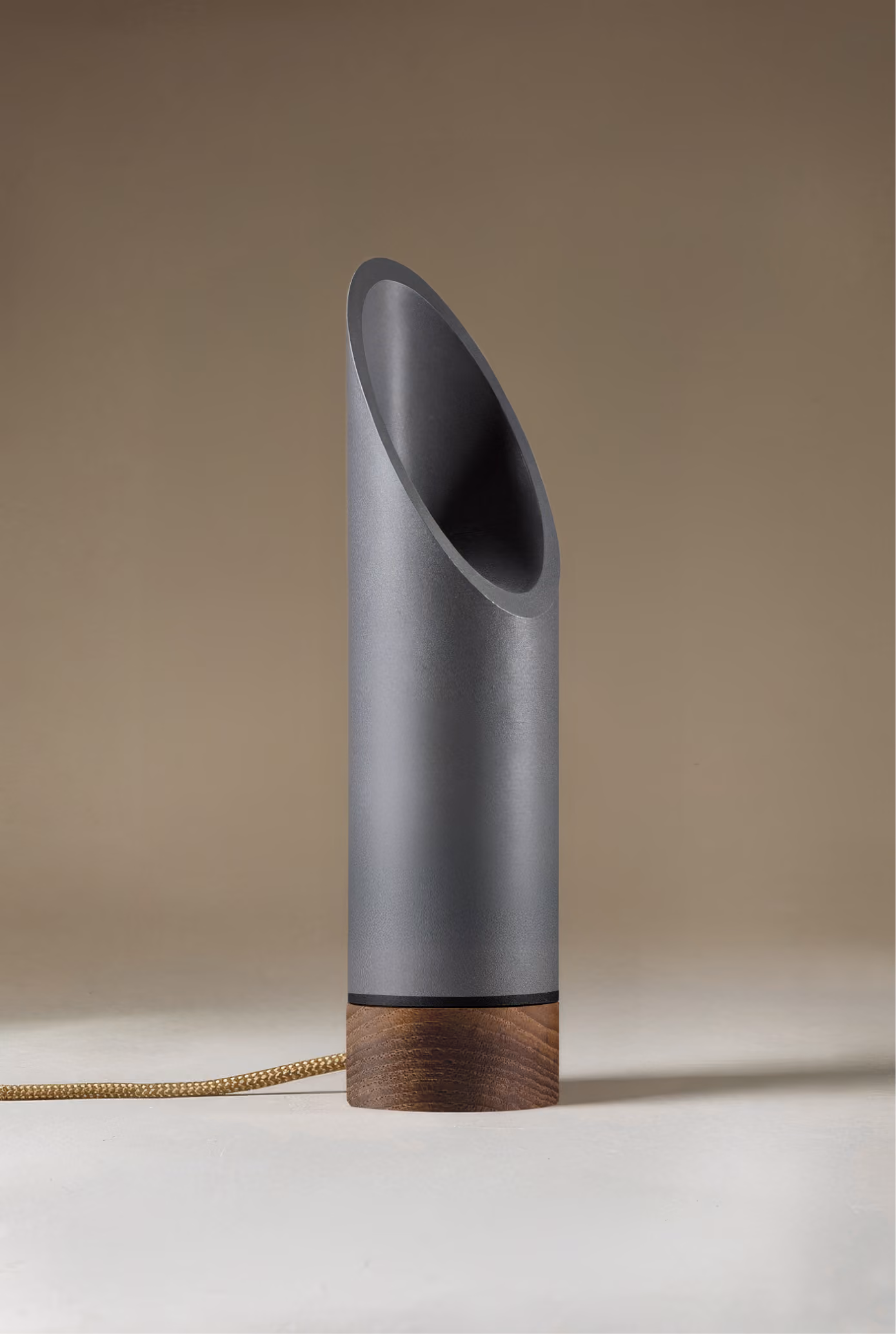 Crafted from salvaged skateboard half-pipe sections with warm copper accents.