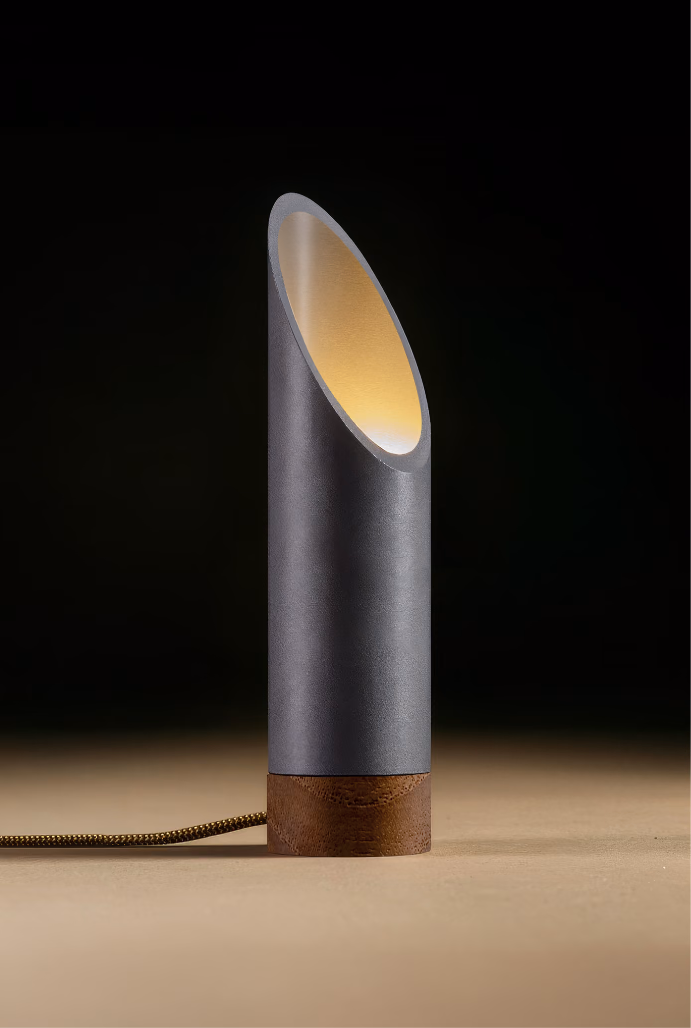 Crafted from salvaged skateboard half-pipe sections with warm copper accents.
