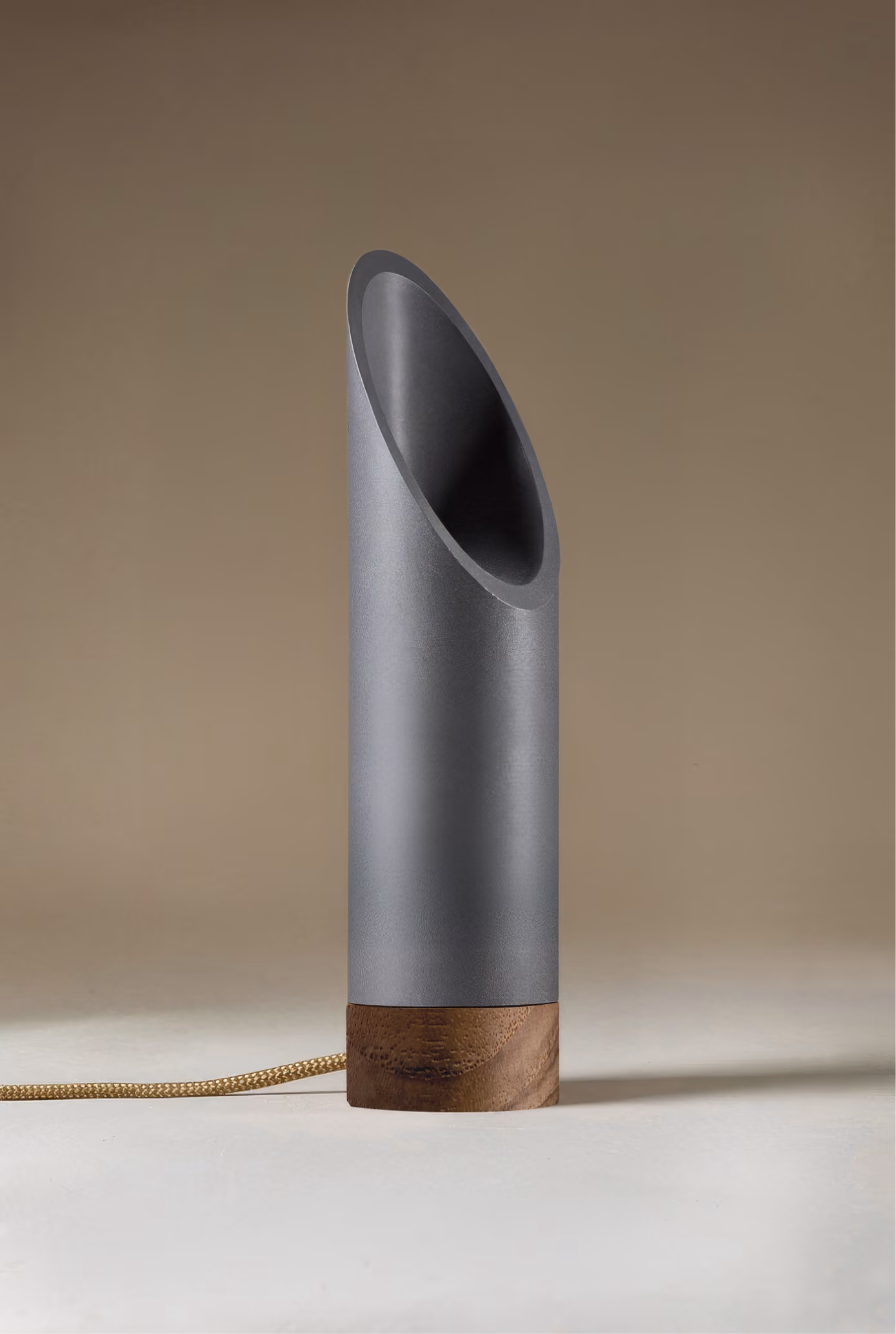 Crafted from salvaged skateboard half-pipe sections with warm copper accents.