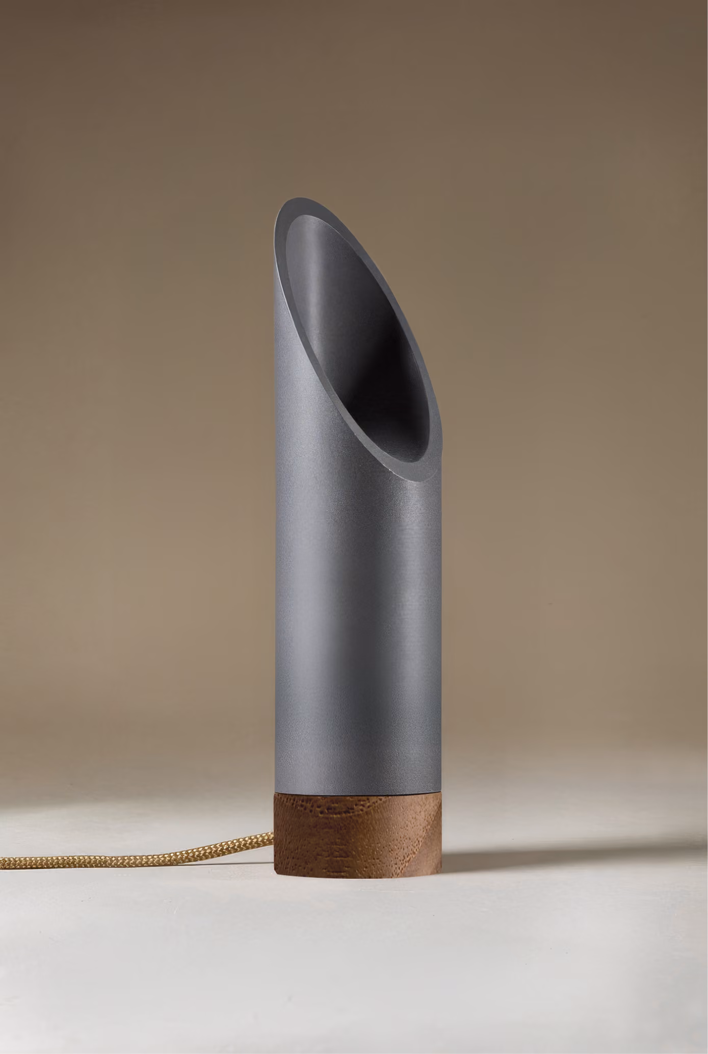 Crafted from salvaged skateboard half-pipe sections with warm copper accents.