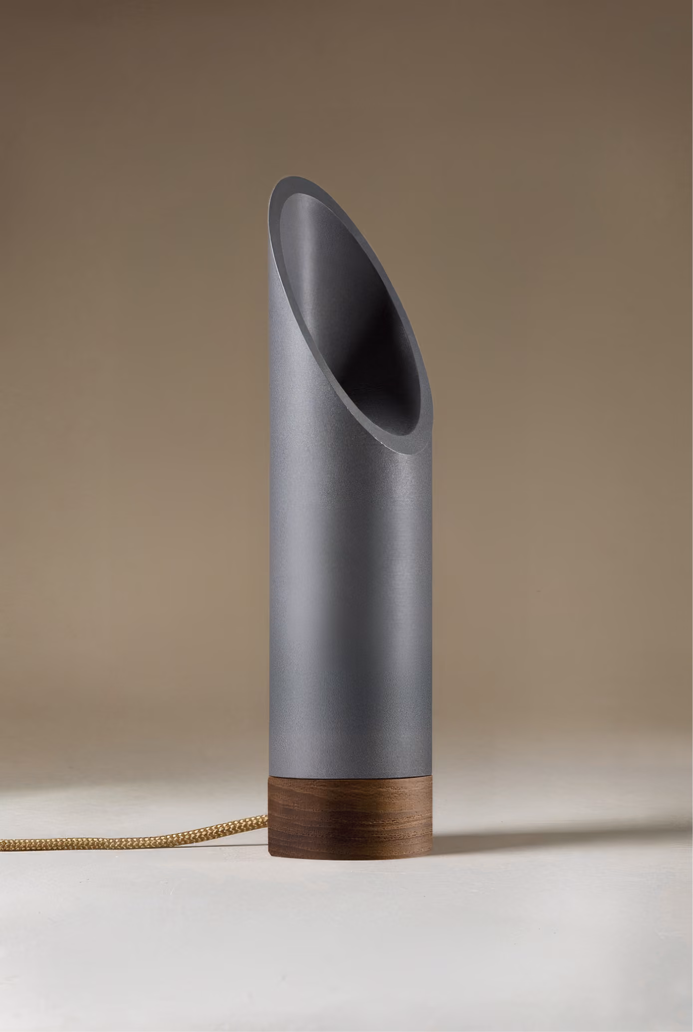 Crafted from salvaged skateboard half-pipe sections with warm copper accents.