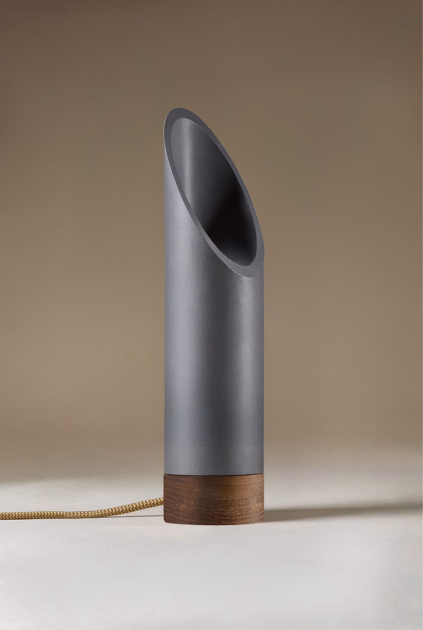 Crafted from salvaged skateboard half-pipe sections with warm copper accents.