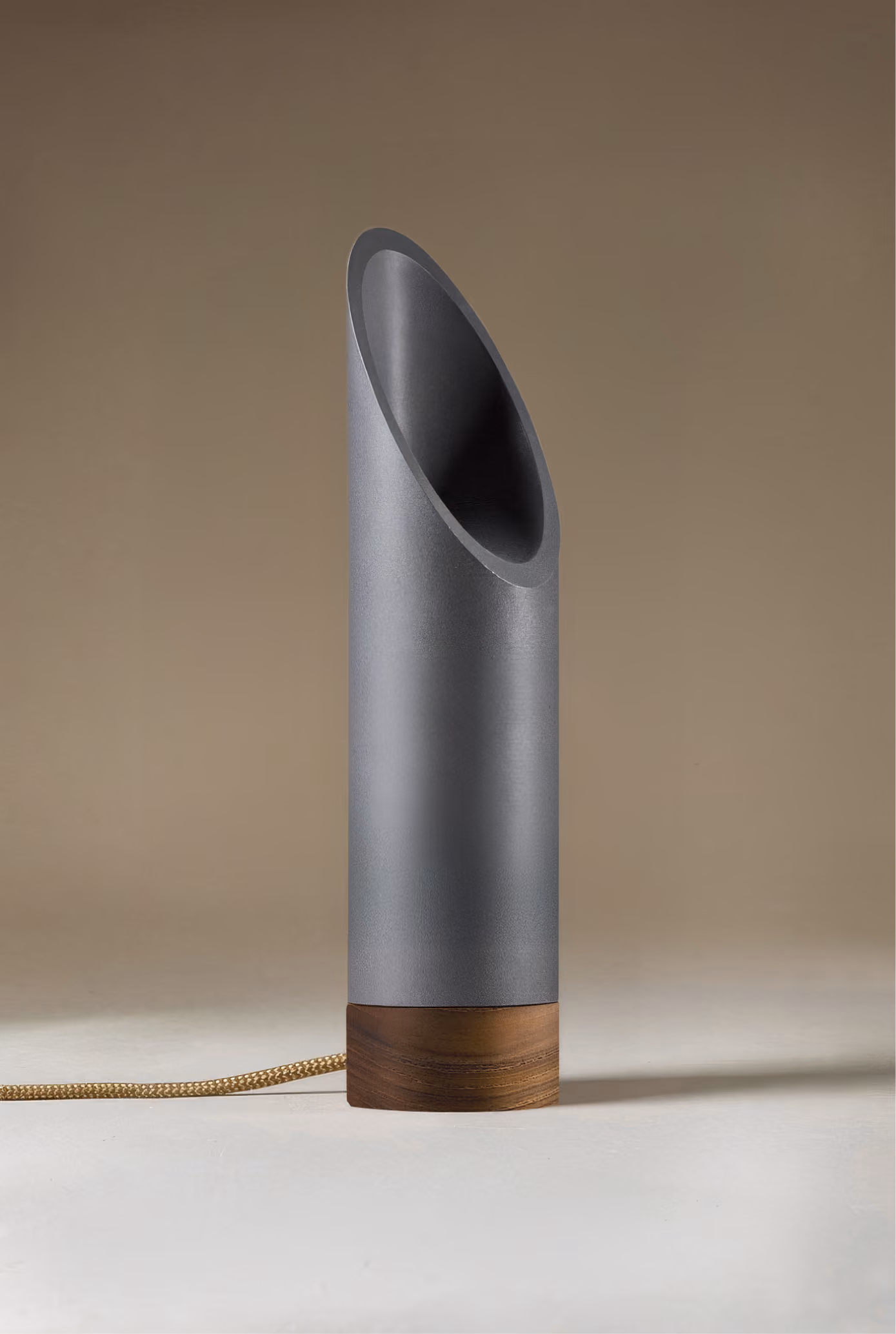 Crafted from salvaged skateboard half-pipe sections with warm copper accents.
