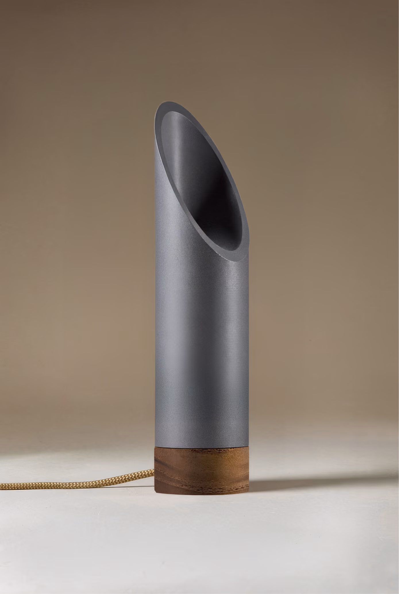 Crafted from salvaged skateboard half-pipe sections with warm copper accents.