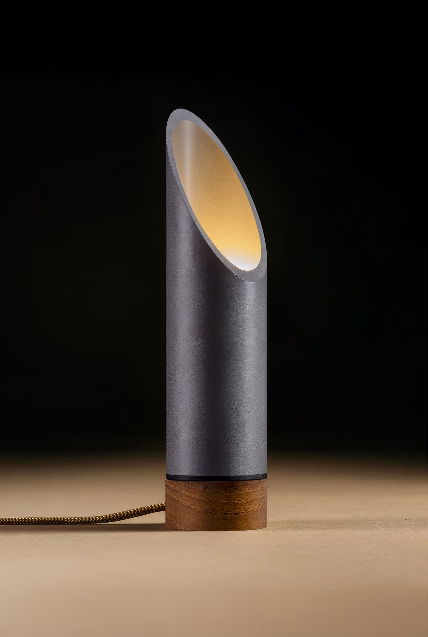 Crafted from salvaged skateboard half-pipe sections with warm copper accents.