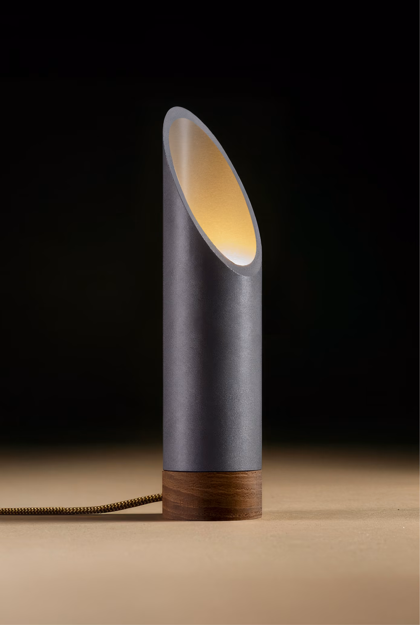 Crafted from salvaged skateboard half-pipe sections with warm copper accents.