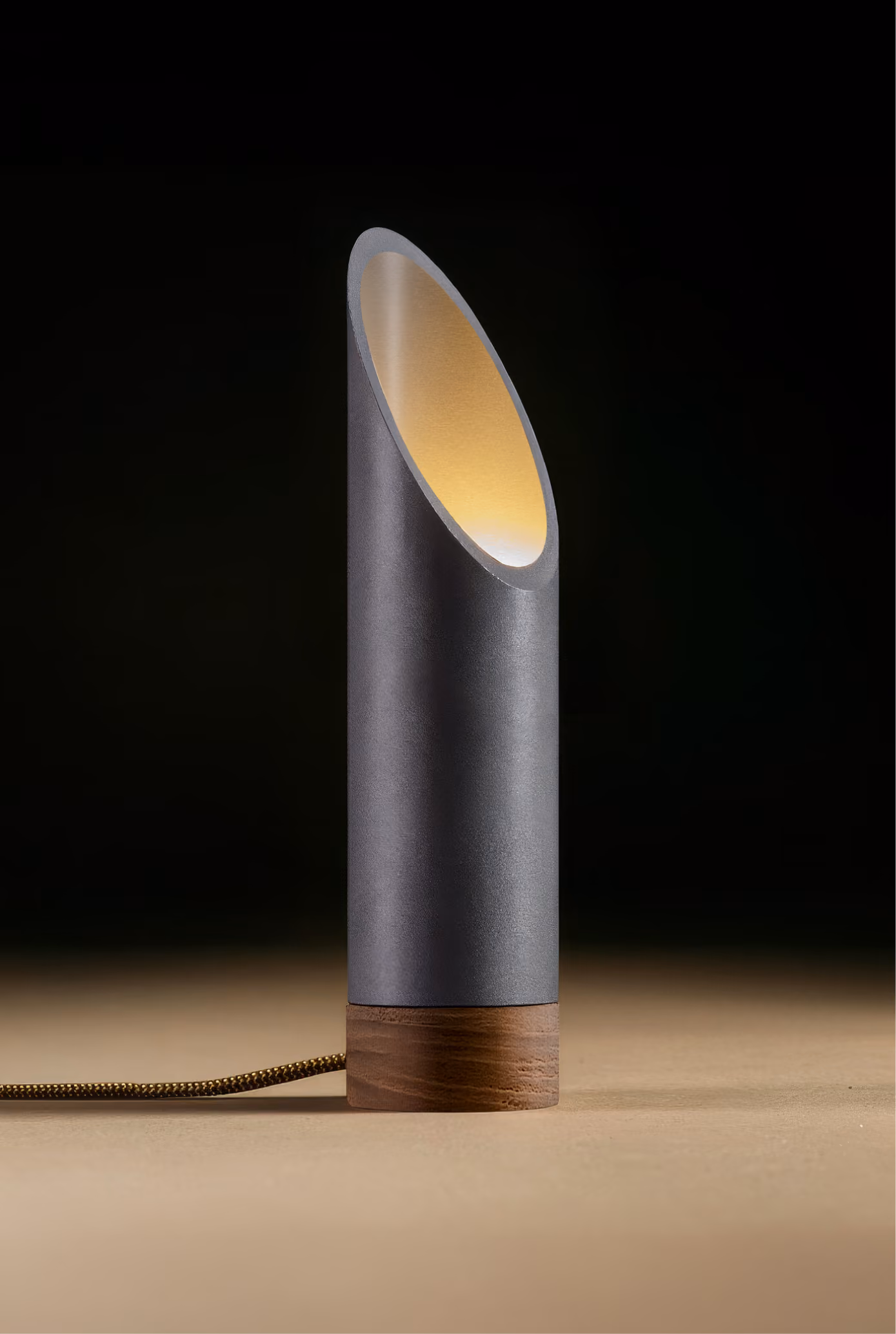 Crafted from salvaged skateboard half-pipe sections with warm copper accents.