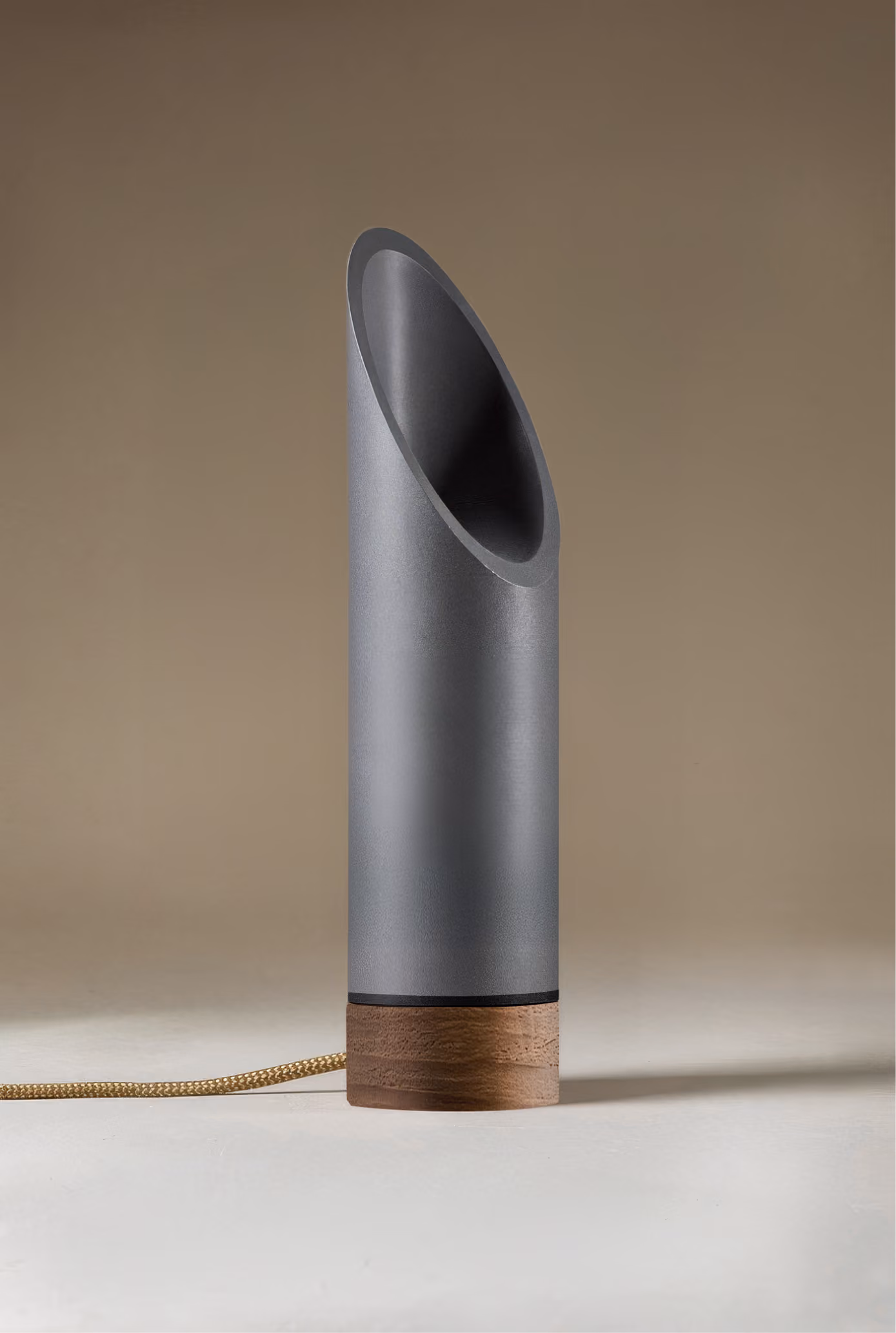 Crafted from salvaged skateboard half-pipe sections with warm copper accents.