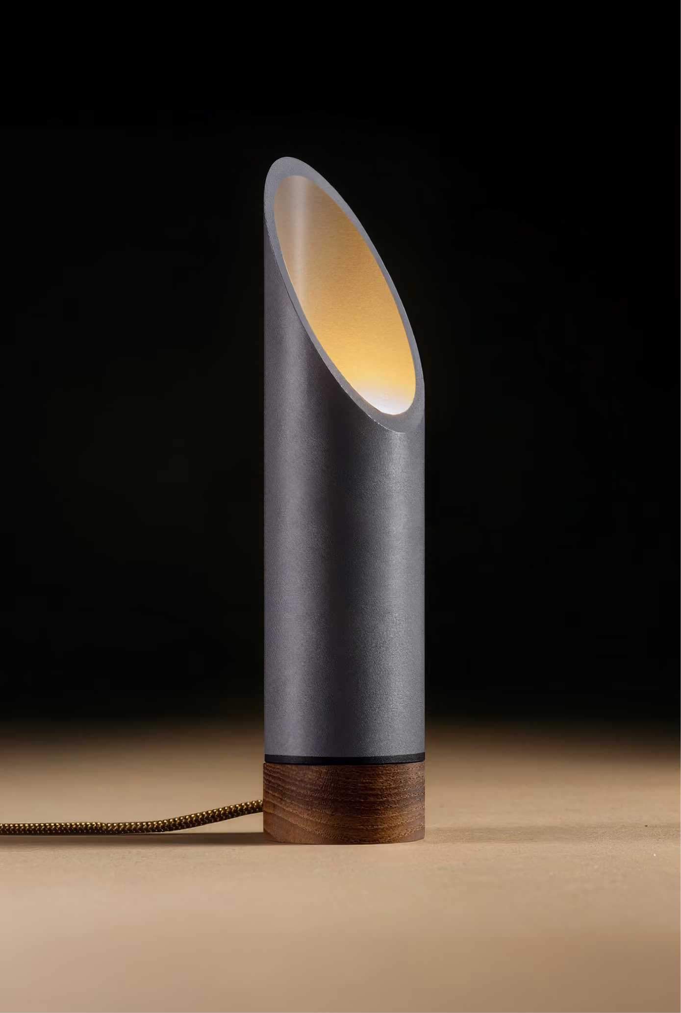 Crafted from salvaged skateboard half-pipe sections with warm copper accents.