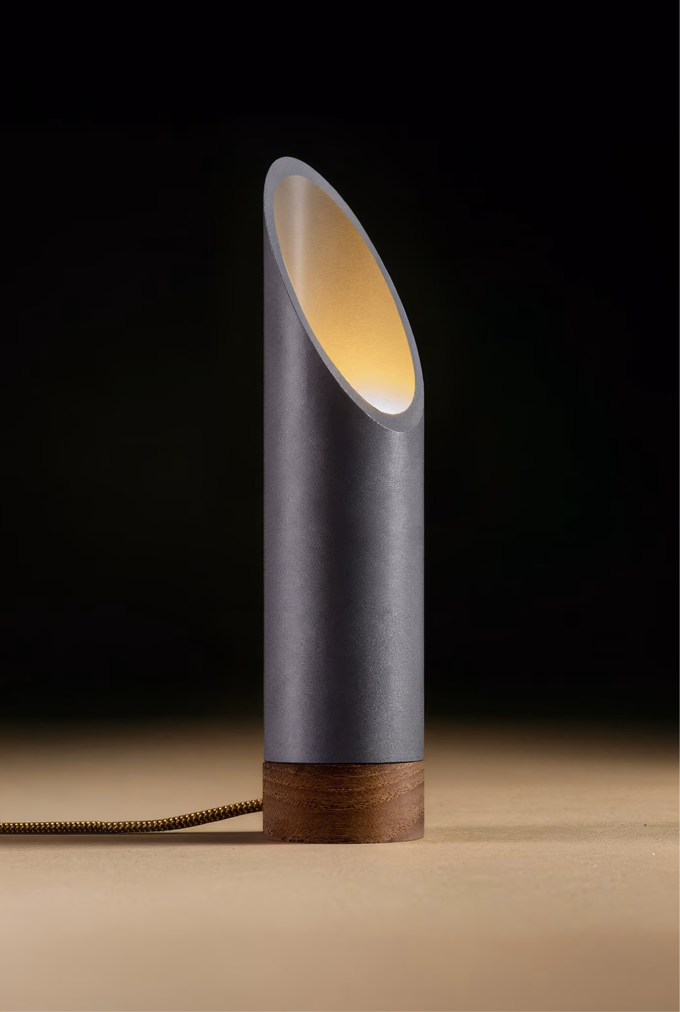 Crafted from salvaged skateboard half-pipe sections with warm copper accents.
