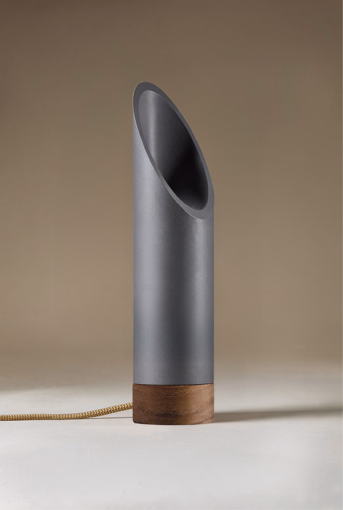 Crafted from salvaged skateboard half-pipe sections with warm copper accents.