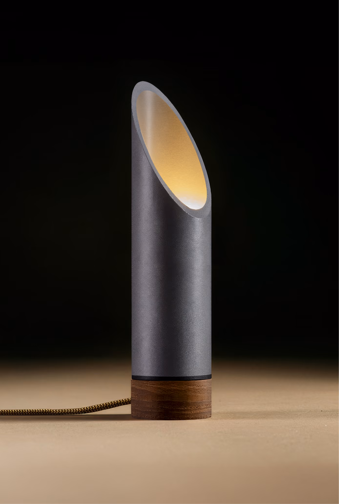 Crafted from salvaged skateboard half-pipe sections with warm copper accents.