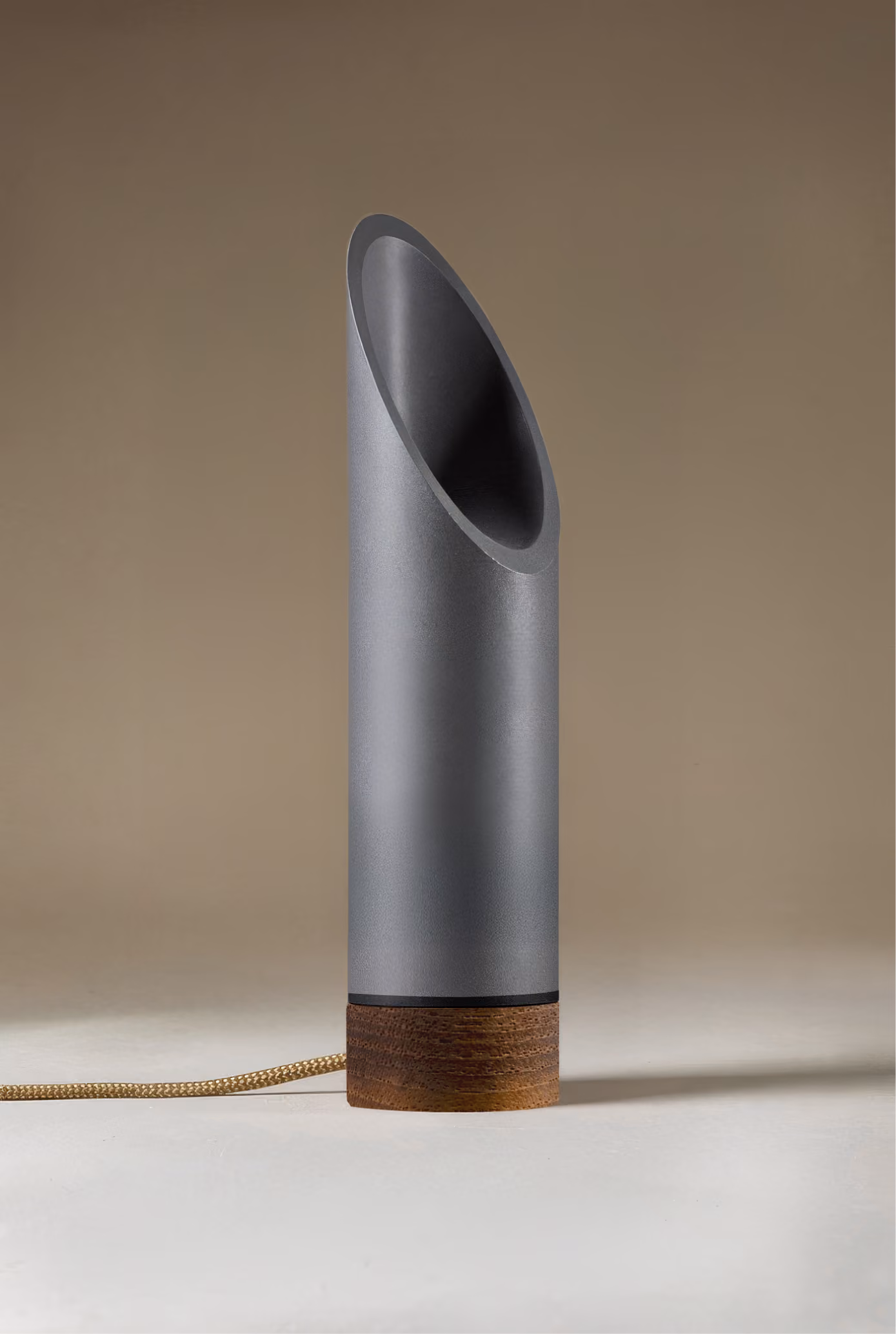 Crafted from salvaged skateboard half-pipe sections with warm copper accents.