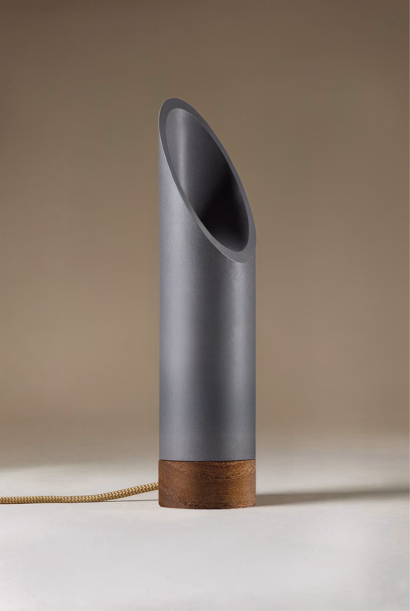 Crafted from salvaged skateboard half-pipe sections with warm copper accents.