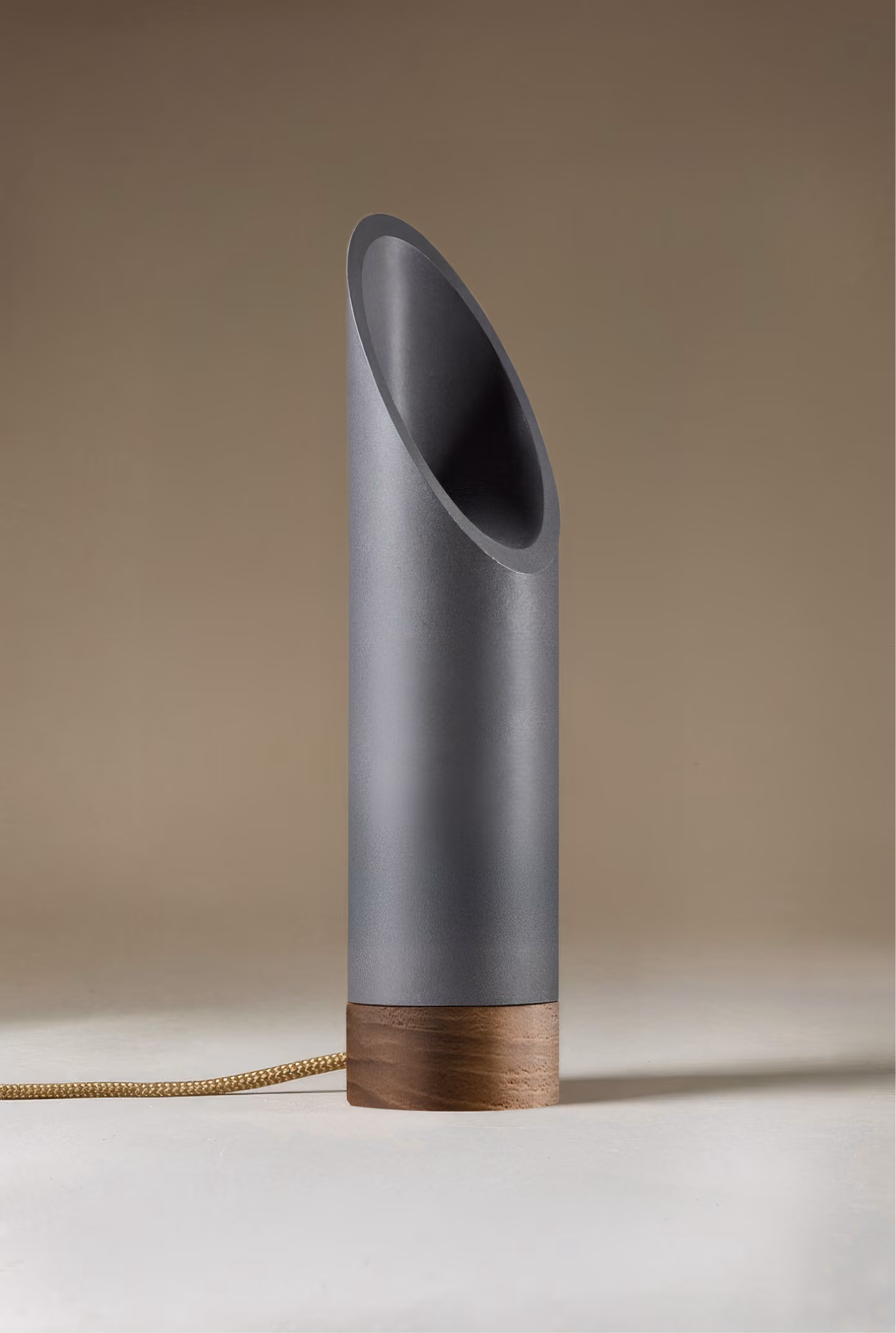 Crafted from salvaged skateboard half-pipe sections with warm copper accents.