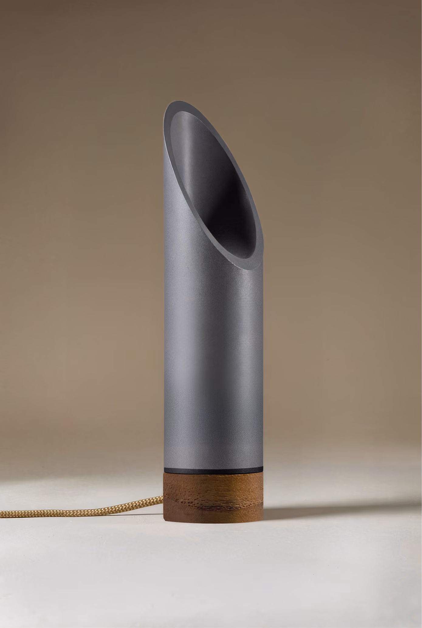 Crafted from salvaged skateboard half-pipe sections with warm copper accents.