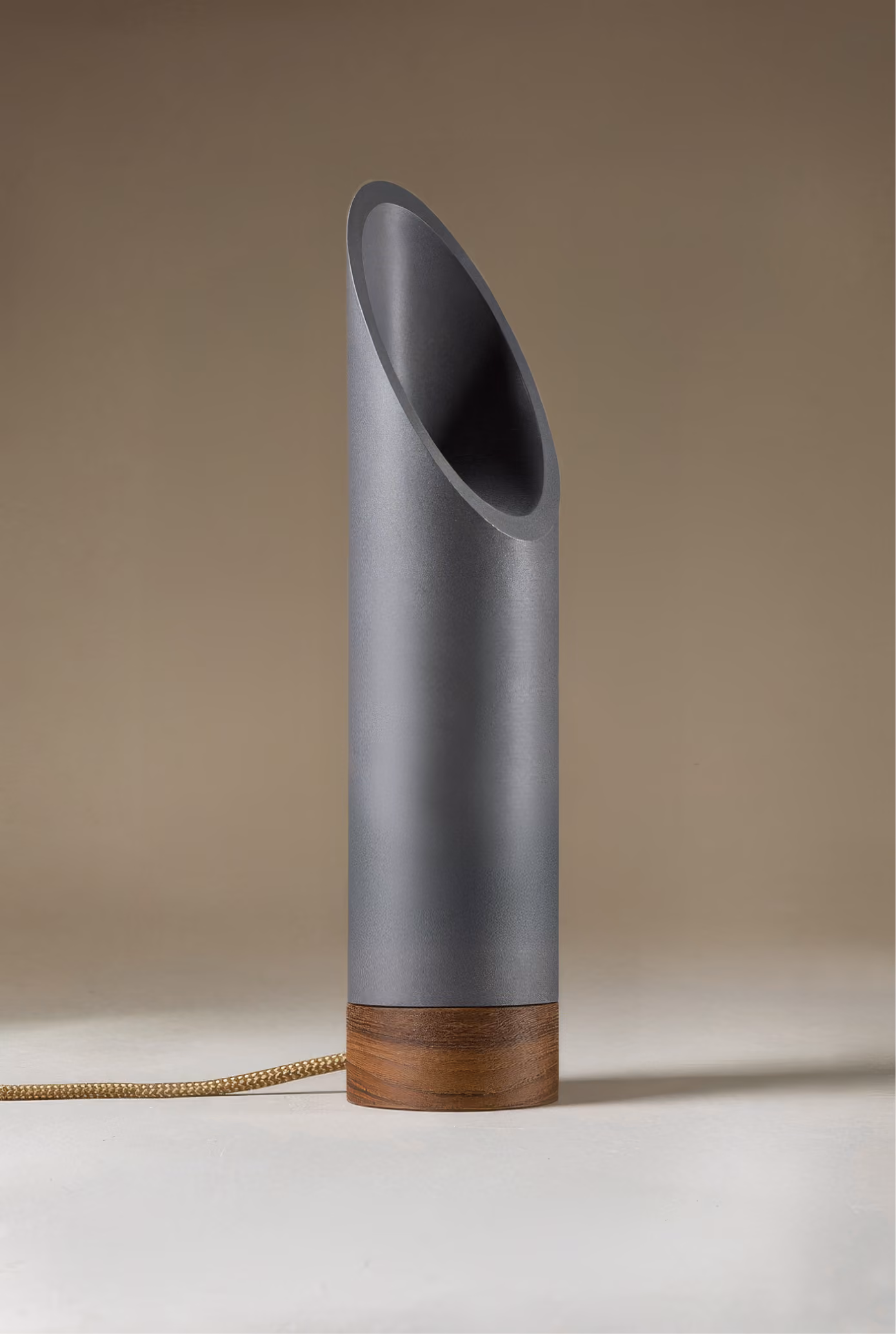 Crafted from salvaged skateboard half-pipe sections with warm copper accents.