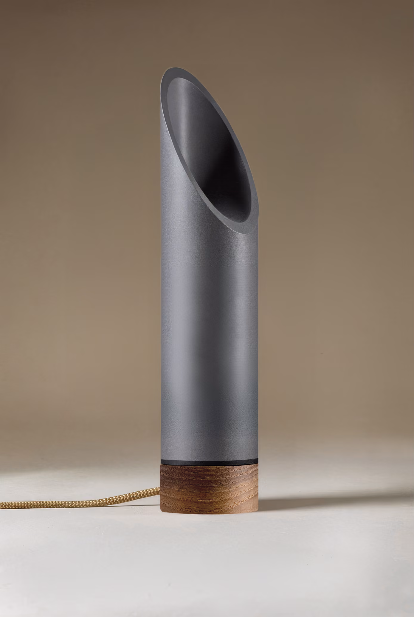 Crafted from salvaged skateboard half-pipe sections with warm copper accents.