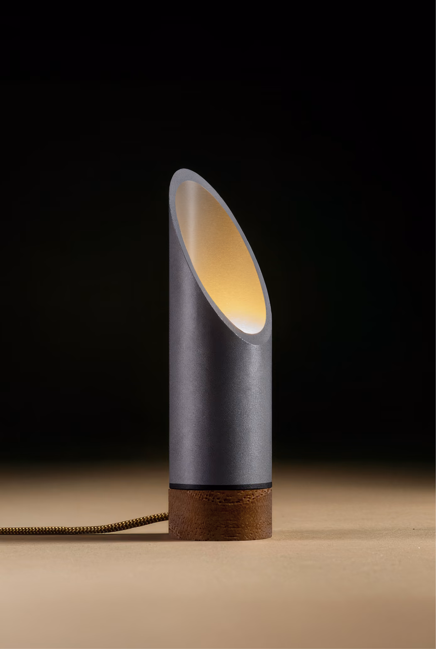 Crafted from salvaged skateboard half-pipe sections with warm copper accents.