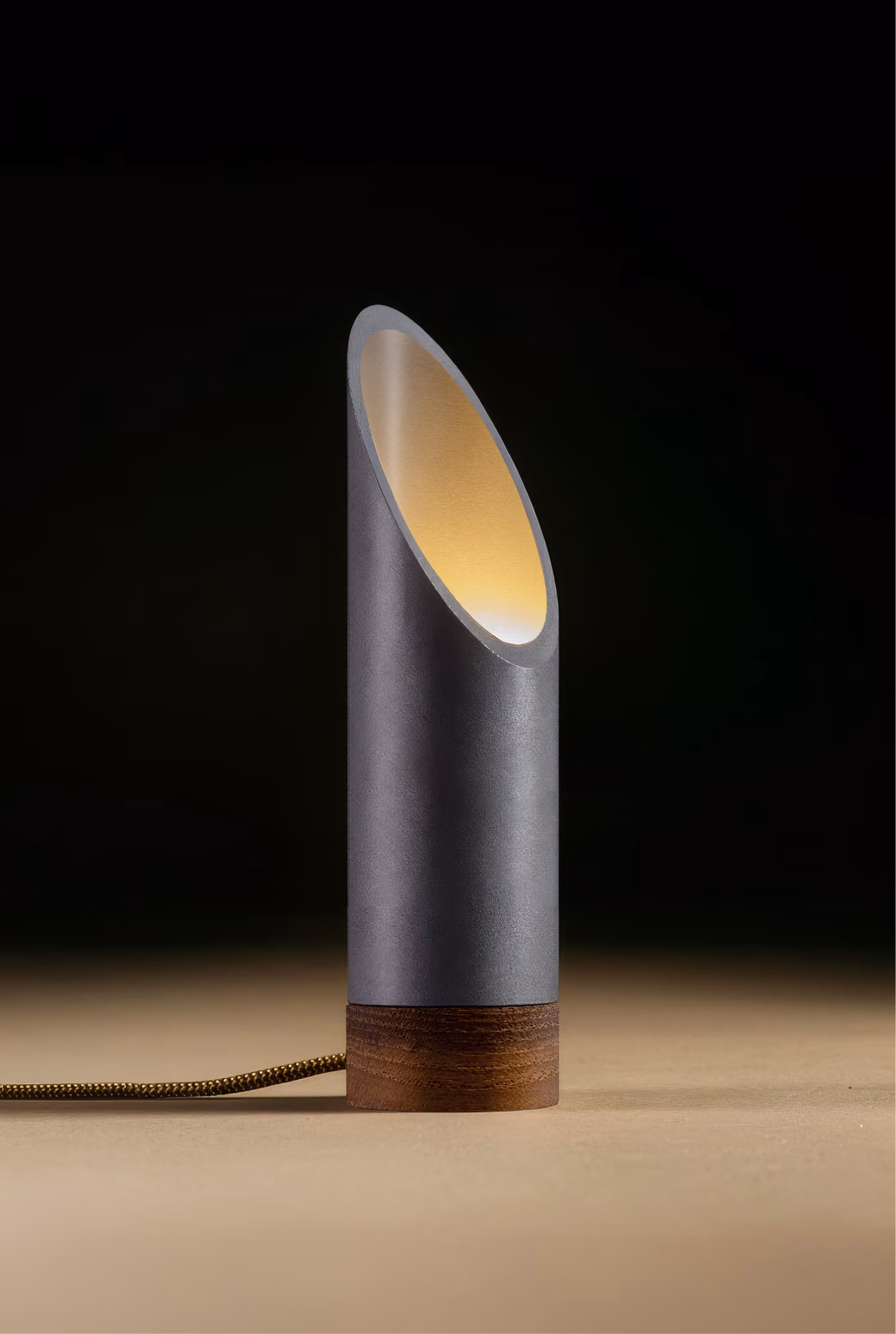 Crafted from salvaged skateboard half-pipe sections with warm copper accents.