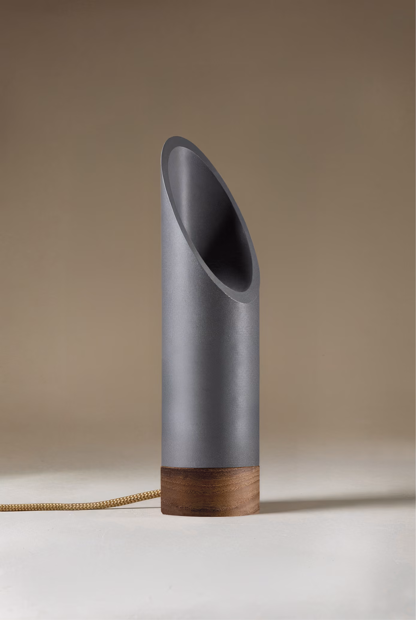 Crafted from salvaged skateboard half-pipe sections with warm copper accents.