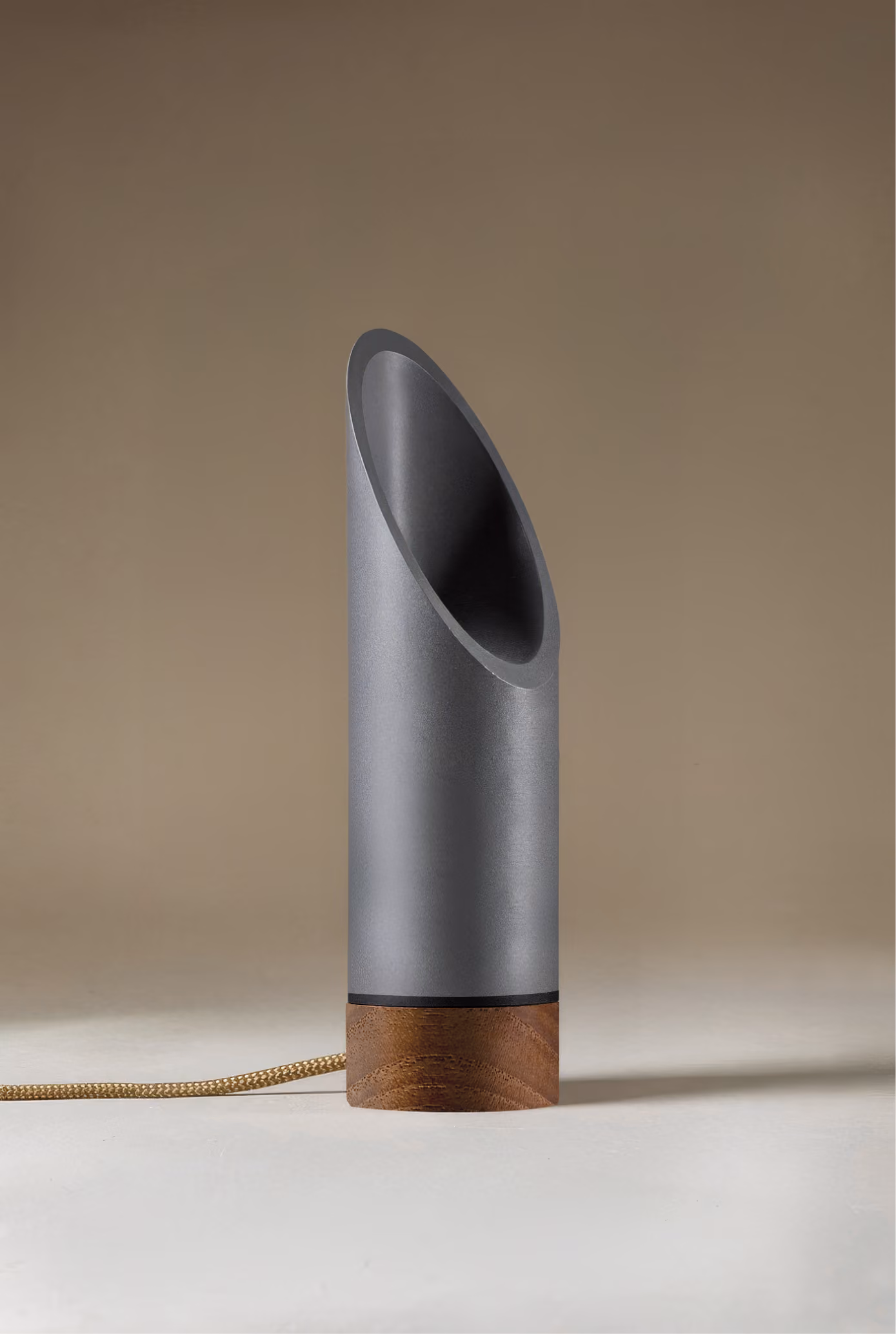 Crafted from salvaged skateboard half-pipe sections with warm copper accents.