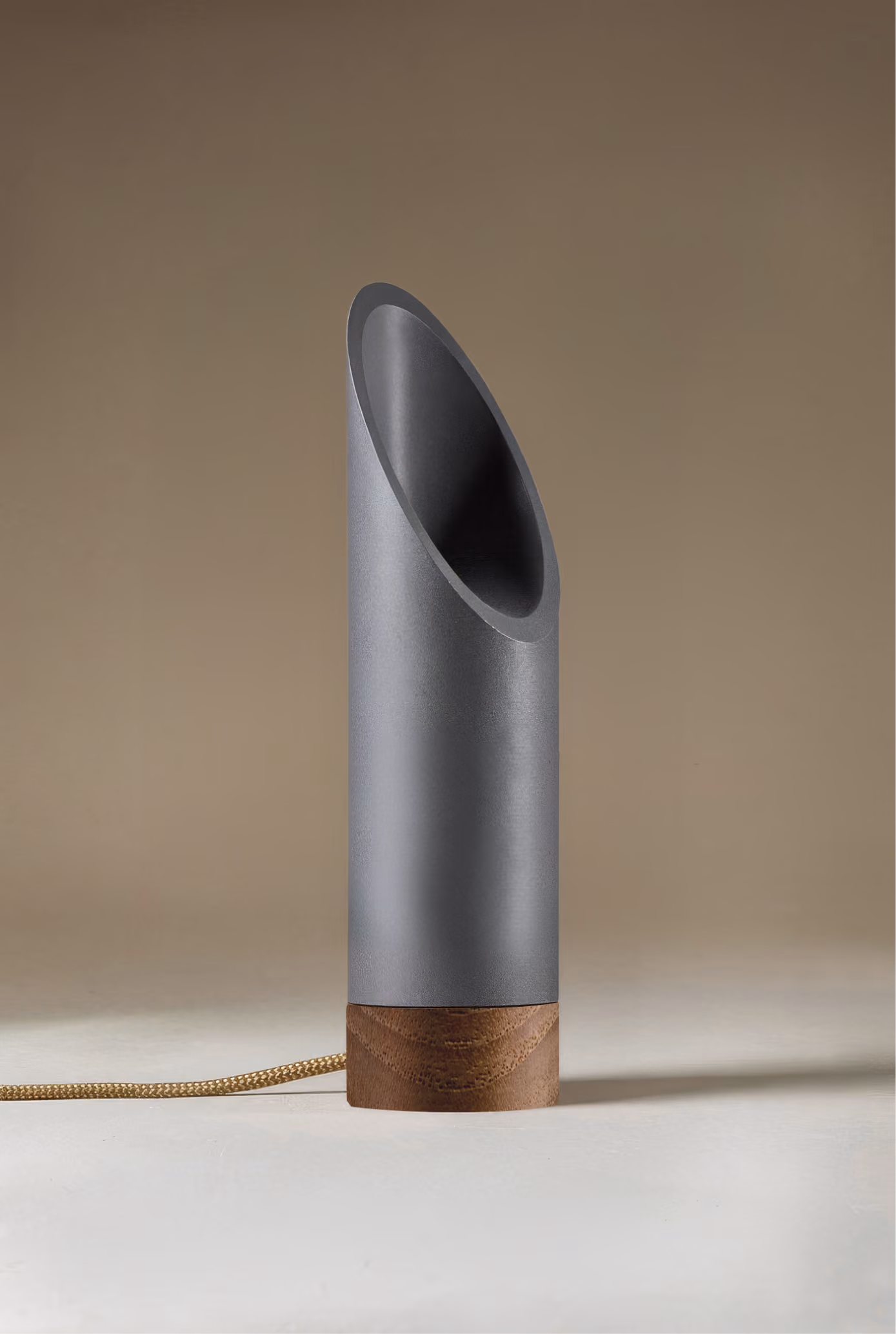Crafted from salvaged skateboard half-pipe sections with warm copper accents.