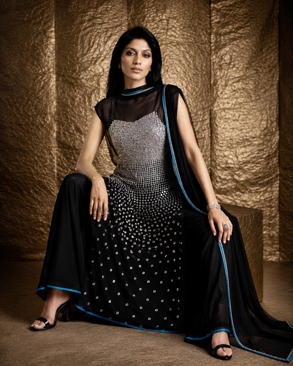 Seated view of black and silver embellished couture ensemble from Silver Eclipse by Alia Qureshi Atelier