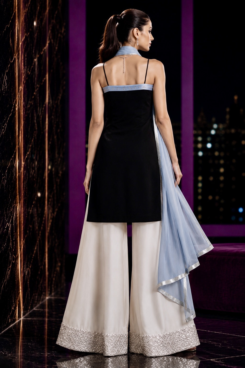 Back view of black and ivory couture ensemble with translucent pale blue dupatta from Pale Horizon by Alia Qureshi Atelier