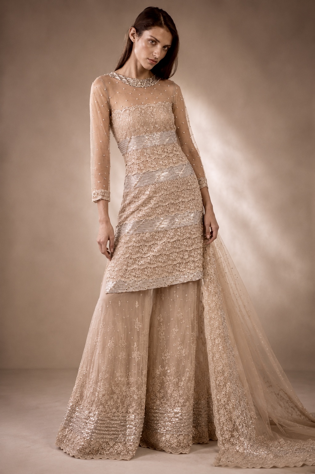 Champagne couture ensemble with sculpted embroidery and fluid layers from Éclat Sculpté by Alia Qureshi Atelier