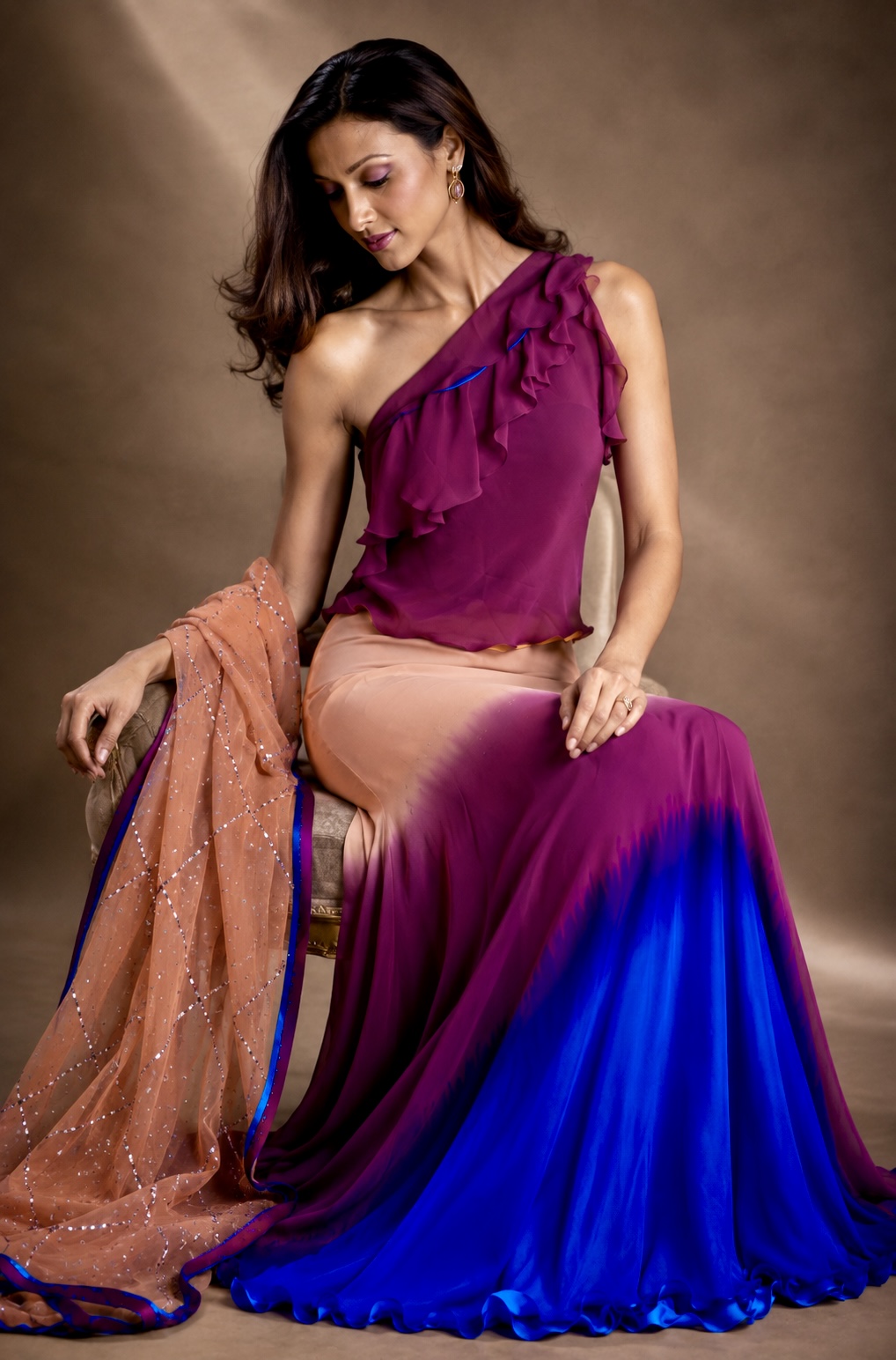 Seated view of blush magenta and cobalt ombré couture ensemble from Chromatic Veil by Alia Qureshi Atelier