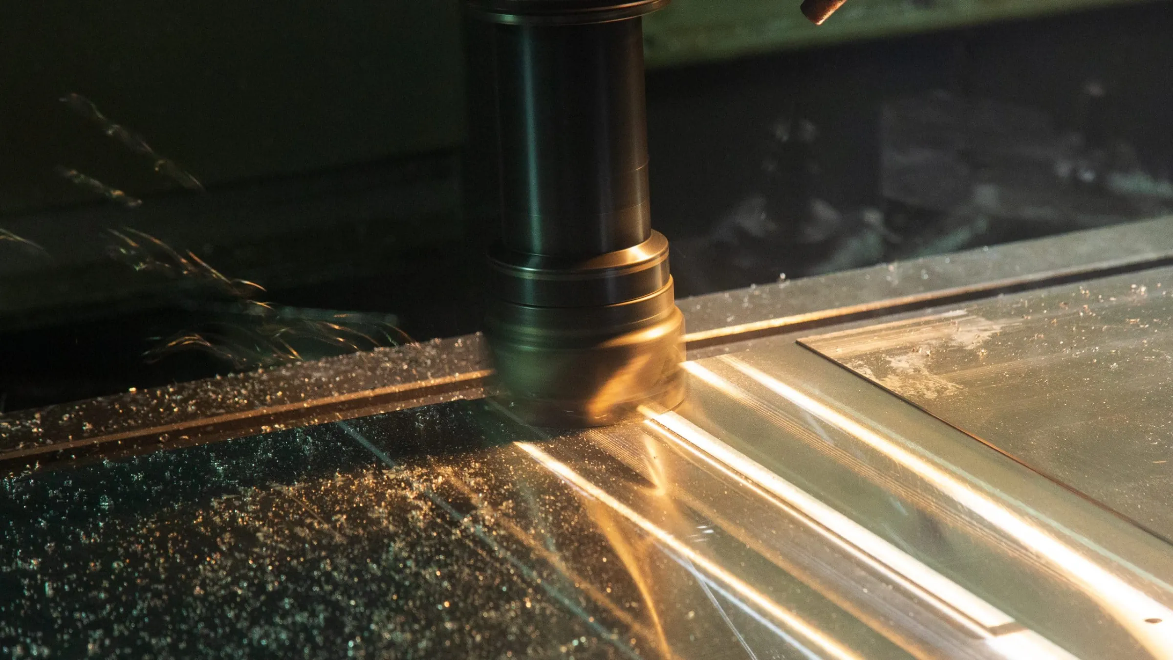 CNC machine cutting metal with golden chips