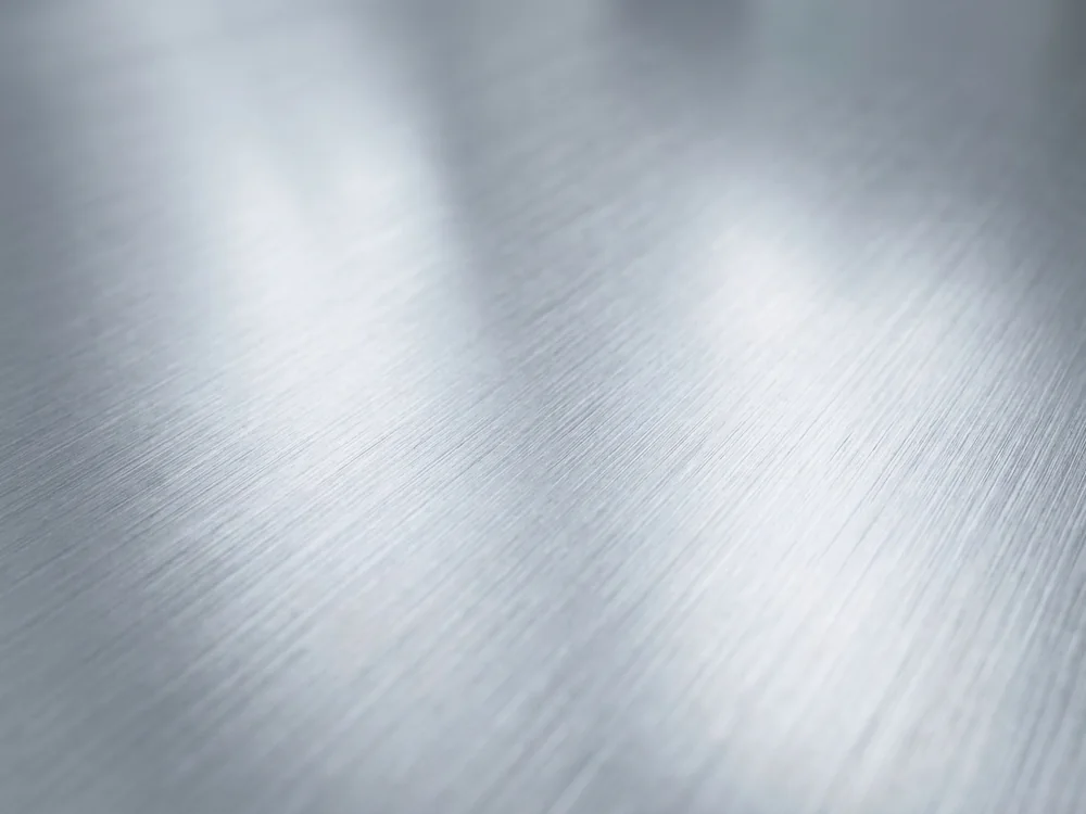 Brushed stainless steel surface with a fine directional grain