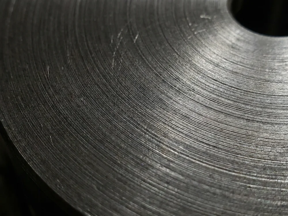 Turned carbon steel surface showing concentric machining marks