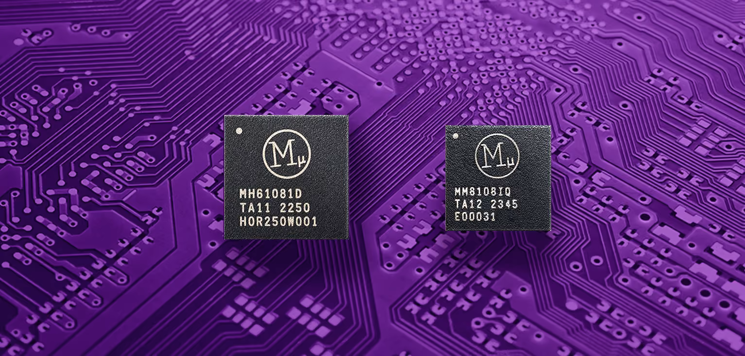 Close-up of a microchip with circuits on a purple printed circuit board background.
