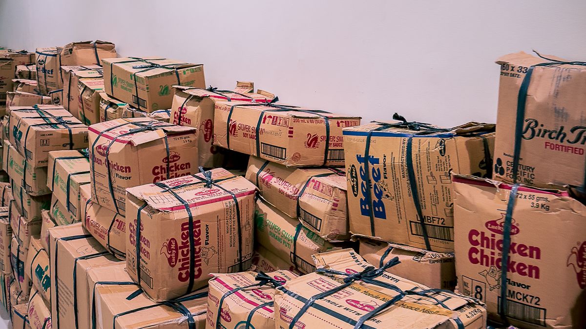 Stacks of unsold cartons piled in a warehouse