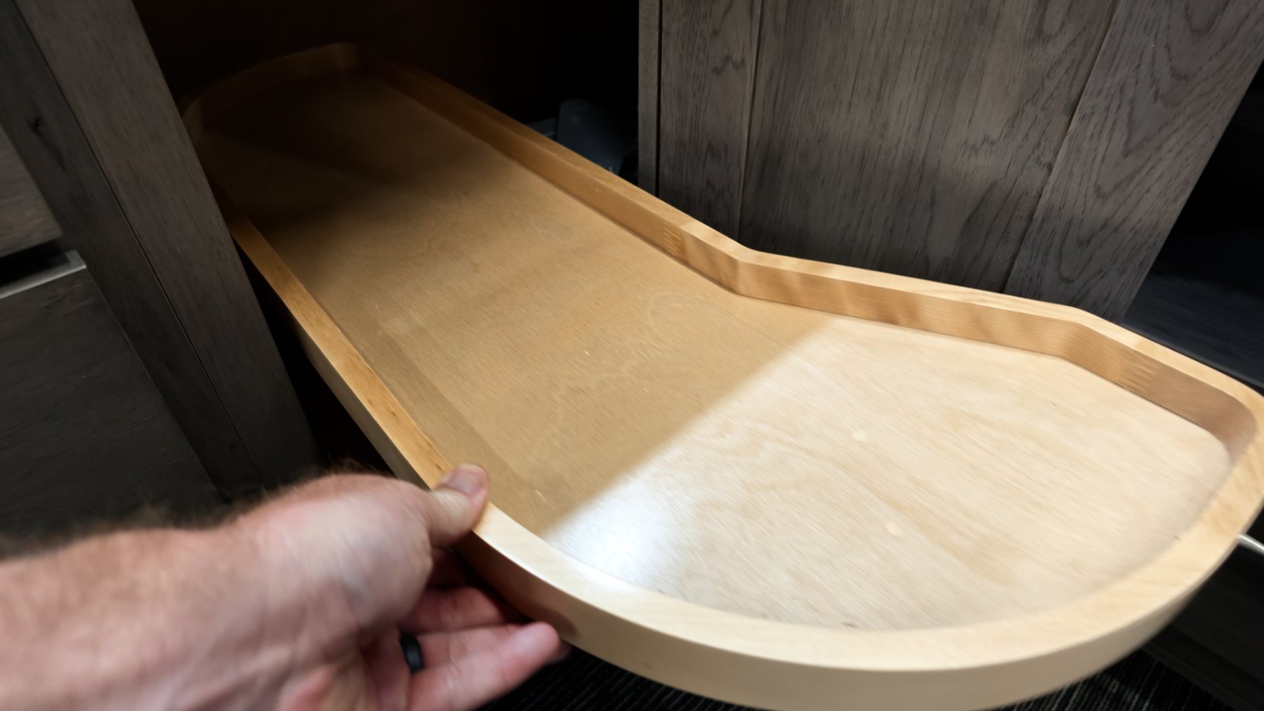 Swing-out shelf in a narrow blind corner cabinet