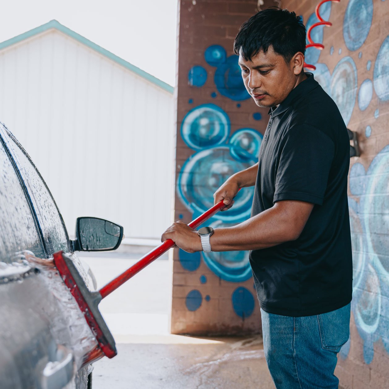Brush-free self-serve car wash bay at Legendary in Cortland IL