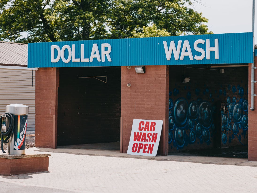 Legendary Car Wash sign at dusk in Cortland IL