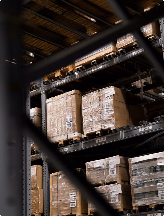 High-bay warehouse racking with palletised, shrink-wrapped goods