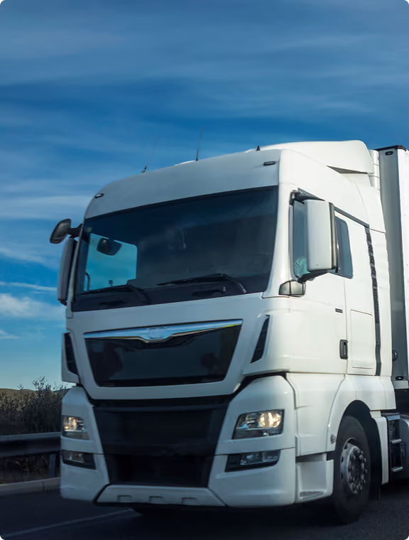 White semi-truck cab on the motorway