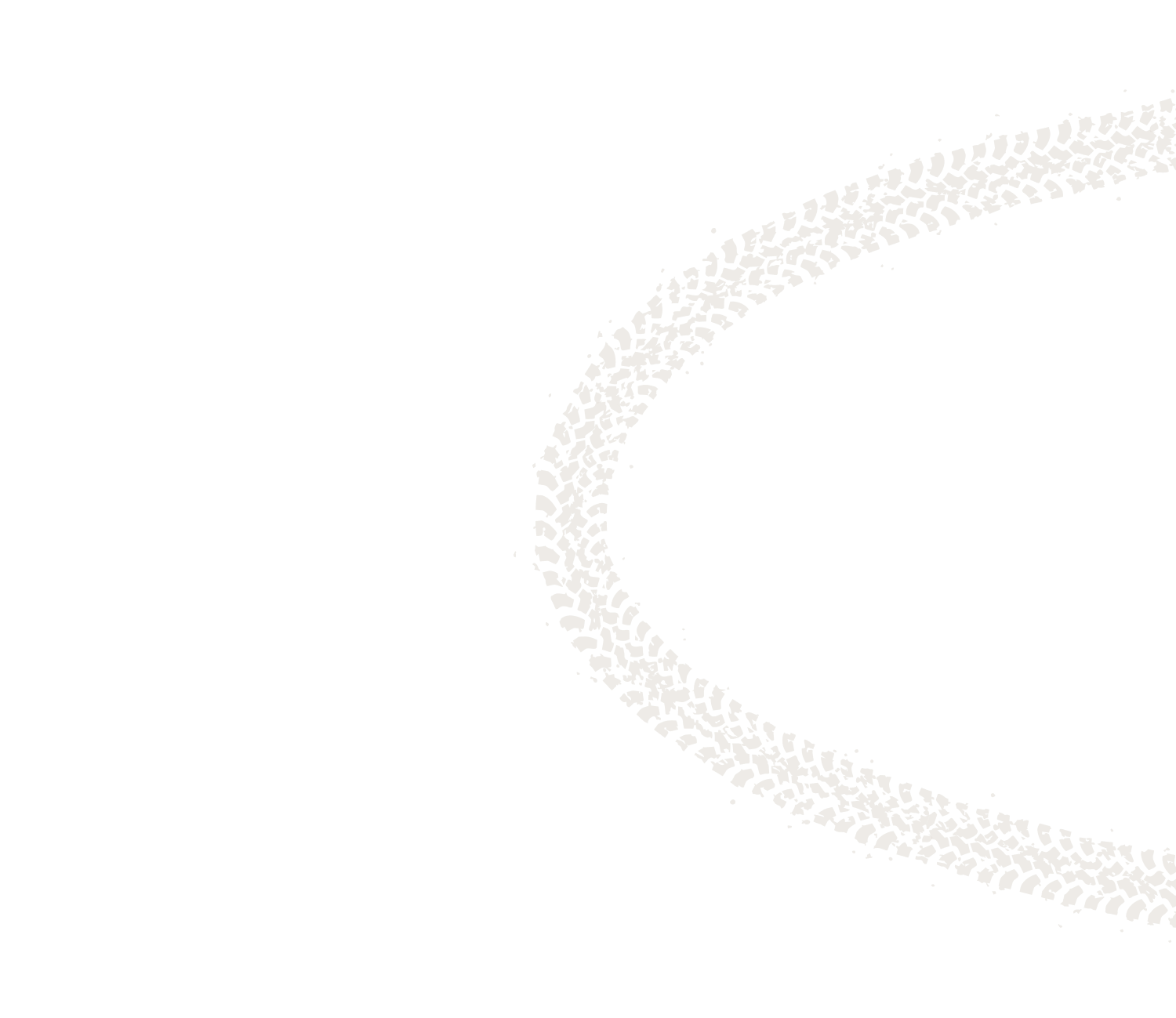 Dual white tire tracks curving on a black background.