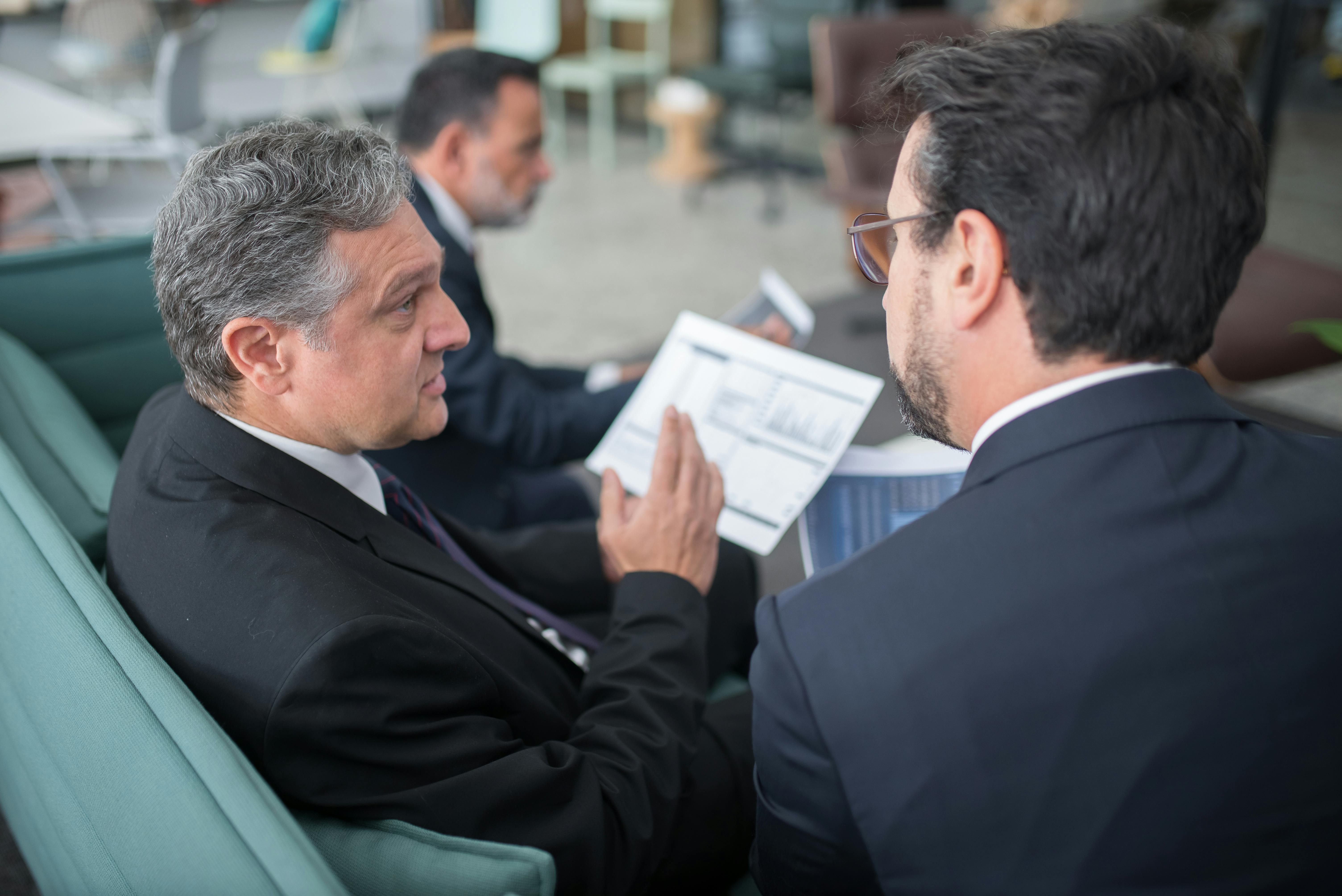 Advisor explaining SBA sources and uses of funds for equity verification