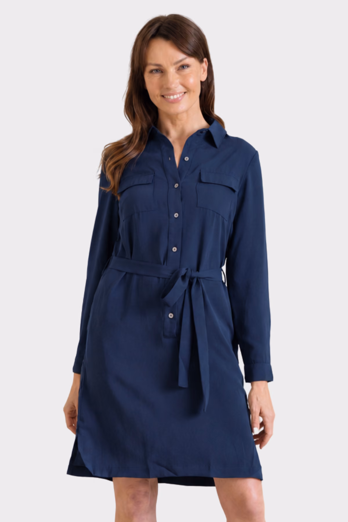 Woman wearing a navy corporate shirt dress with a tie waist