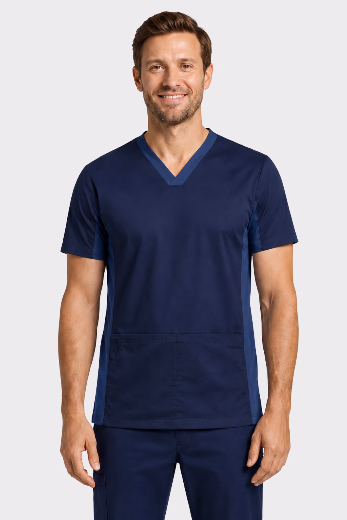Man wearing a navy V-neck healthcare scrub top with matching trousers